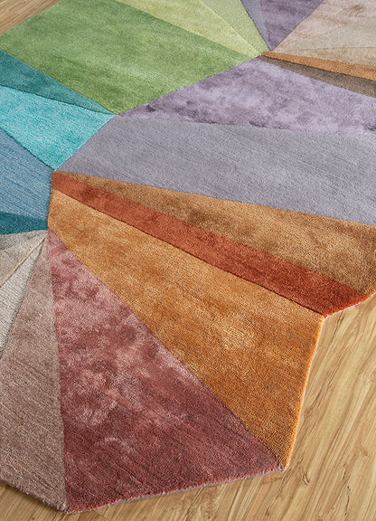 Top angle view of multicolor spectrum hand-tufted wool rug highlighting abstract geometric layout and balanced color tones