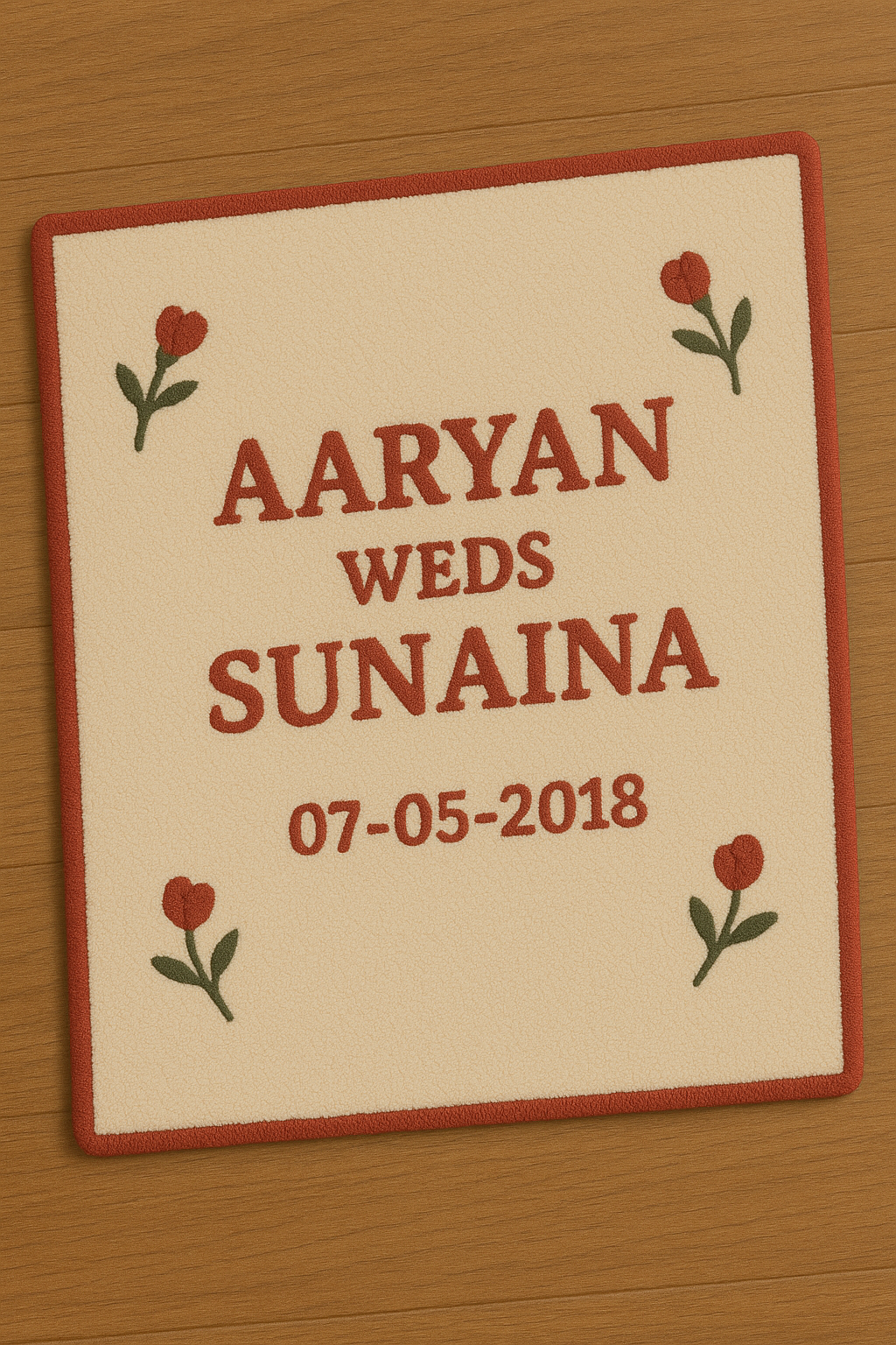 Close-up of Name & Date Anniversary Rug – hand-tufted custom couple rug with Aaryan weds Sunaina text and floral corner details 