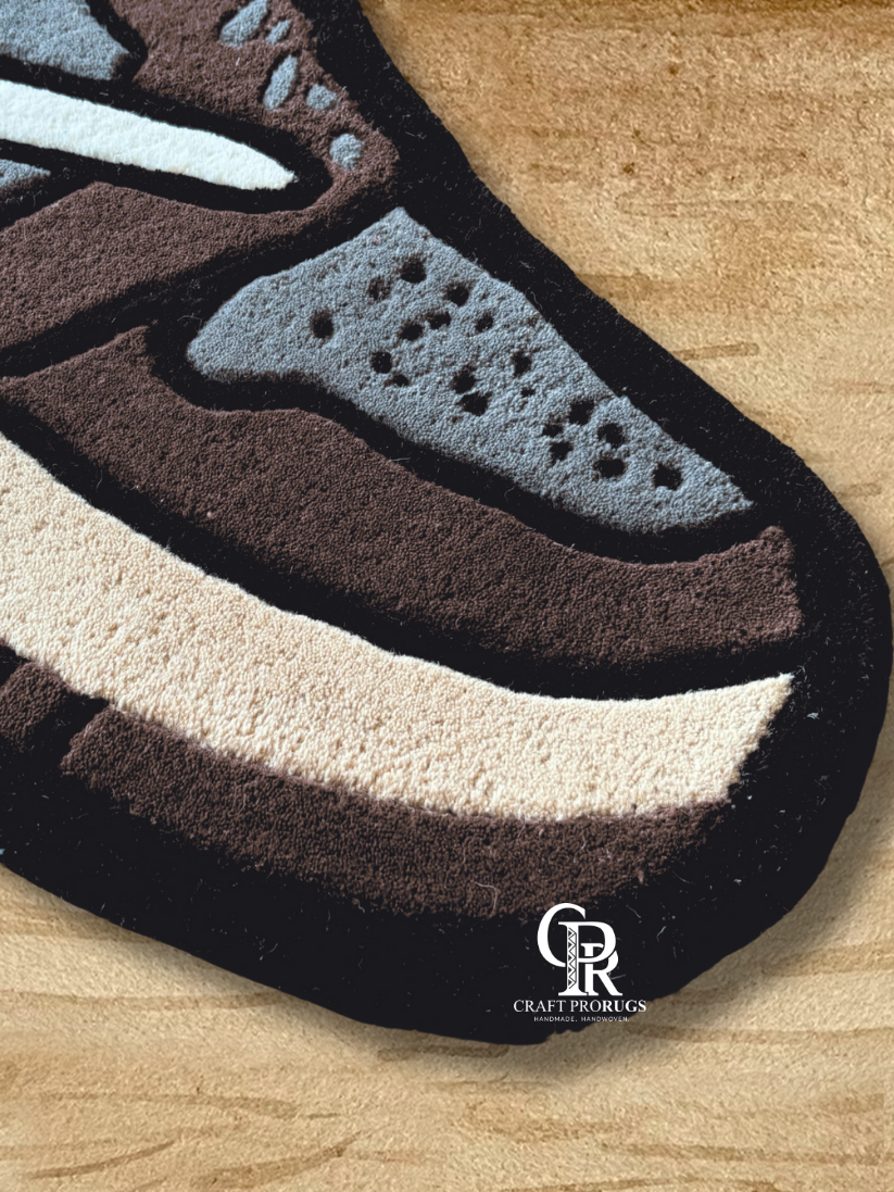 Side angle of hand-tufted Nike shoe shape rug showing plush texture and bold sneaker design on floor