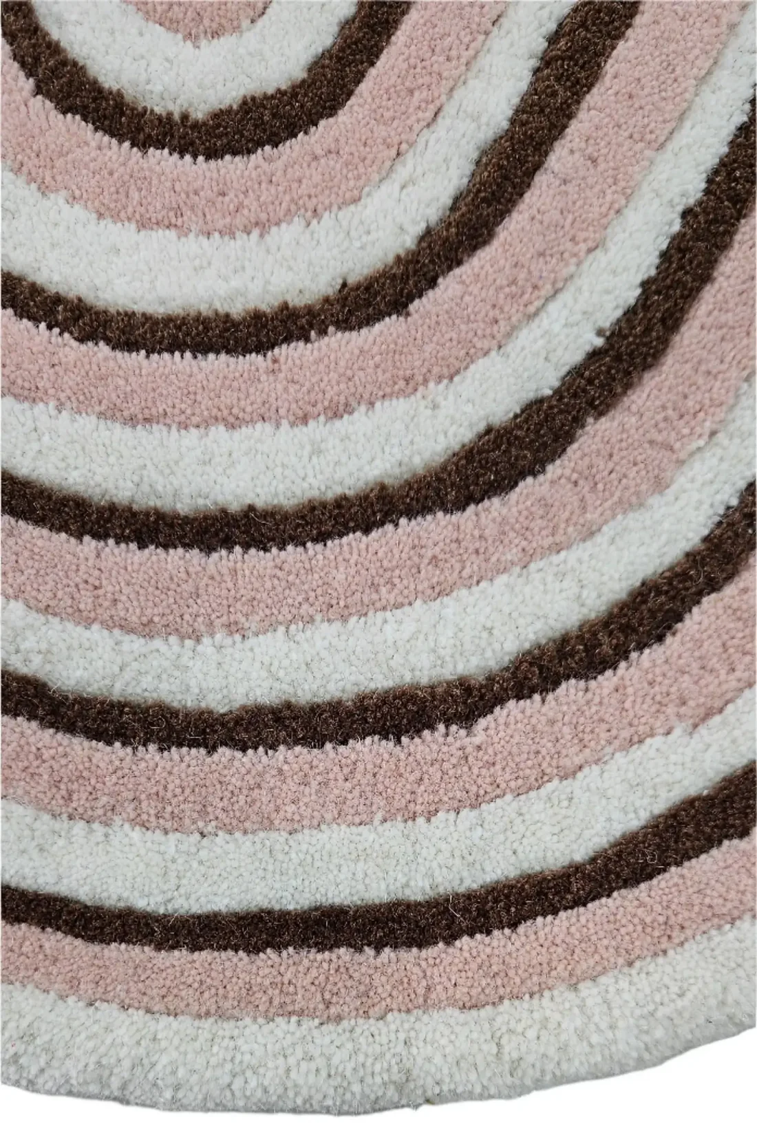 Close view of Omee Terra Contour hand tufted wool rug highlighting curved stripe pattern with blended earthy colors