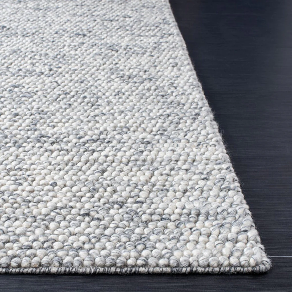 Pebble texture flatweave pure wool rug corner showing clean handwoven edges