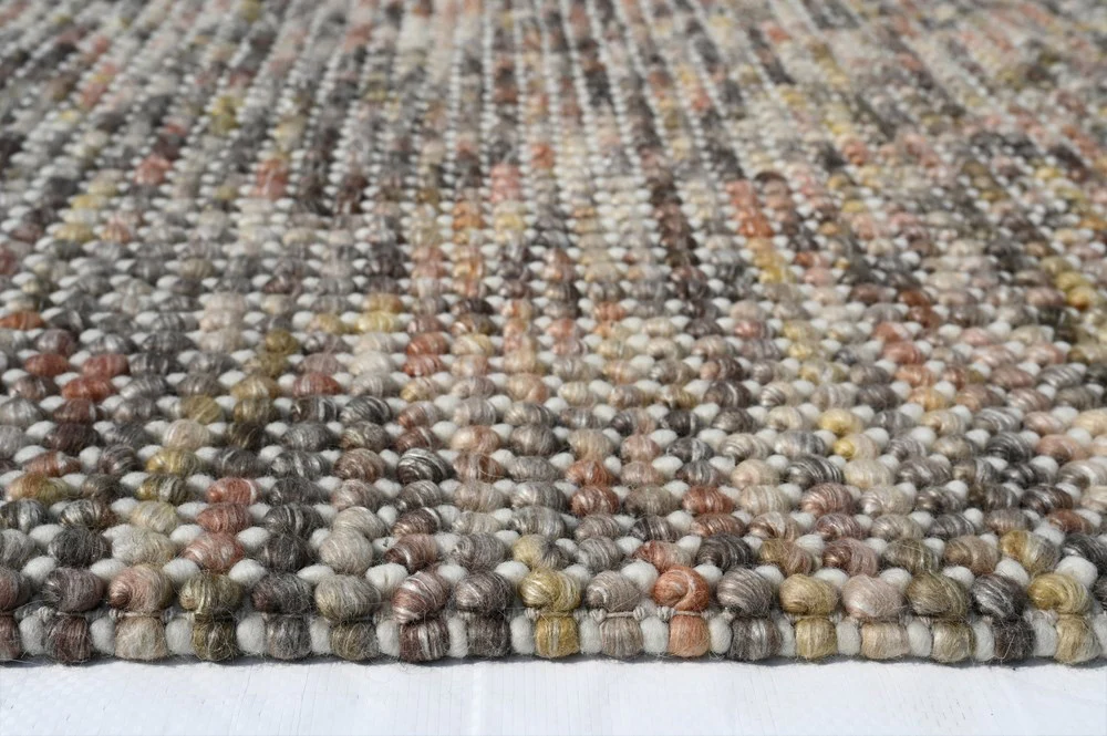 Side close-up of Pebbles Magic Multi Grey flatweave rug highlighting soft texture, thin profile, and quality craftsmanship