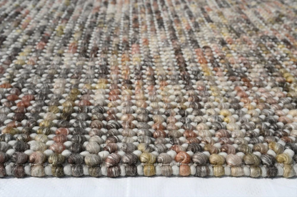 Side close-up of Pebbles Magic Multi Grey flatweave rug highlighting soft texture, thin profile, and quality craftsmanship