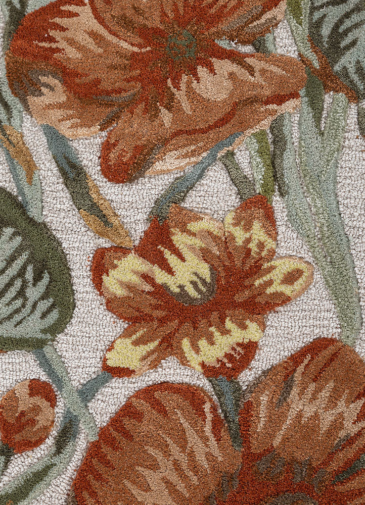Close up texture of Regal Botanique hand tufted wool rug highlighting intricate floral detailing dense pile and smooth finish.