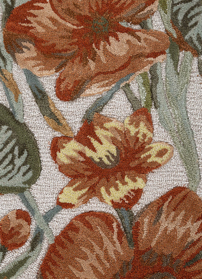 Close up texture of Regal Botanique hand tufted wool rug highlighting intricate floral detailing dense pile and smooth finish.