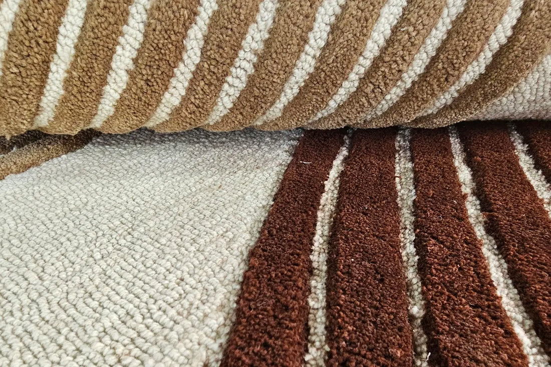 Close view of Sienna Wave hand tufted wool rug highlighting textured pile and layered wave pattern