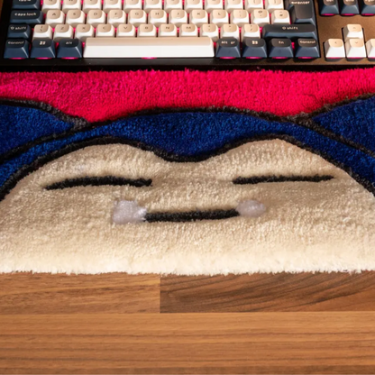 Top view of Snorlax anime keyboard rug with tufted yarn