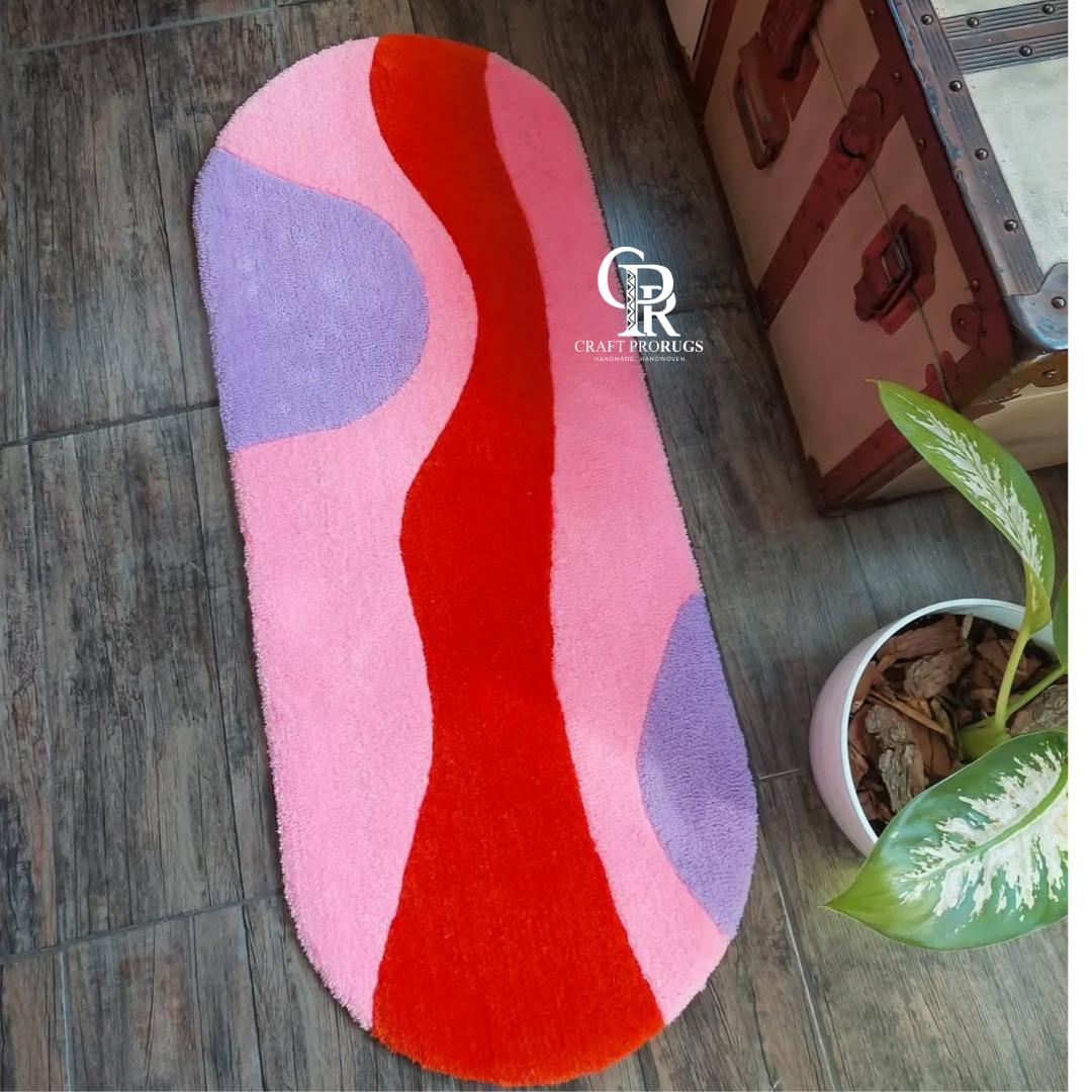Soft Vibe Rug top view showing smooth wavy pattern in red, pink, and lavender colors