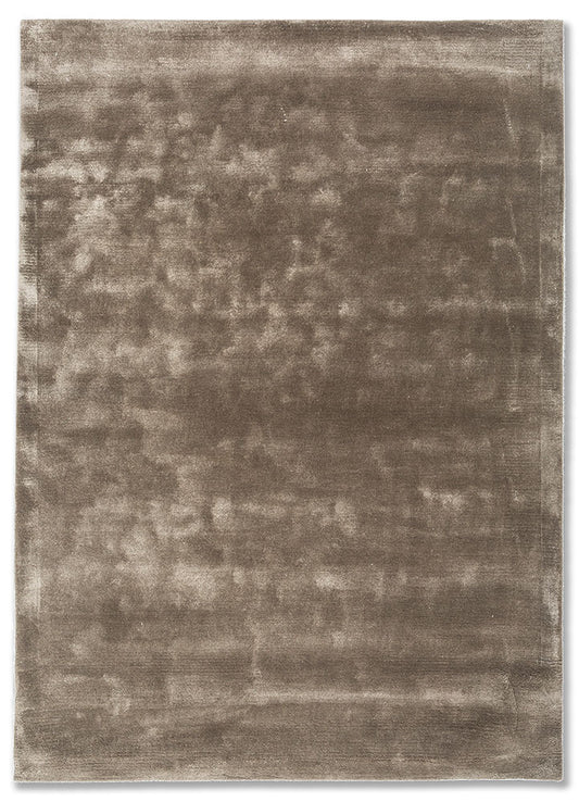 Hand tufted wool rug in soft taupe shade with smooth texture and minimal design, ideal for modern living spaces.