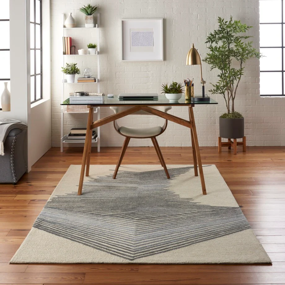 Vetra Prism Linear hand tufted wool rug styled in a modern workspace featuring sharp linear prism pattern in neutral tones.