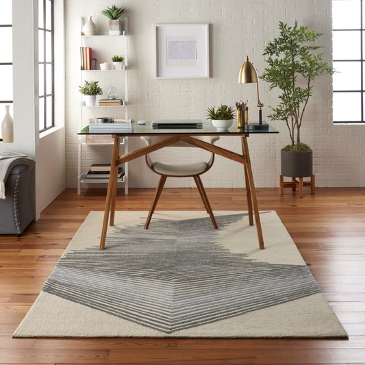 Vetra Prism Linear hand tufted wool rug styled in a modern workspace featuring sharp linear prism pattern in neutral tones.