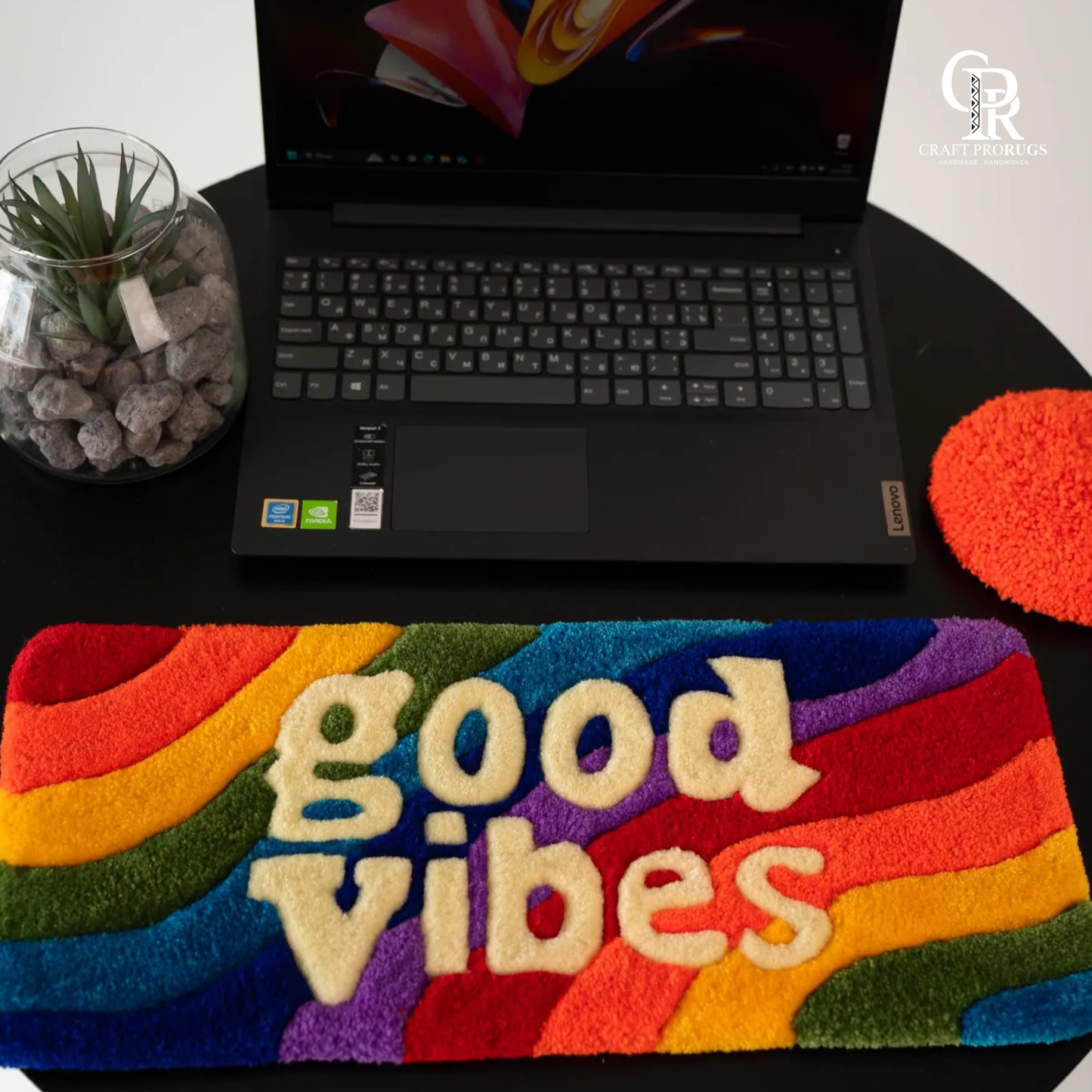 Vibe Stripe Keyboard Rug front view showing rainbow stripes and good vibes text placed in front of laptop for desk setup