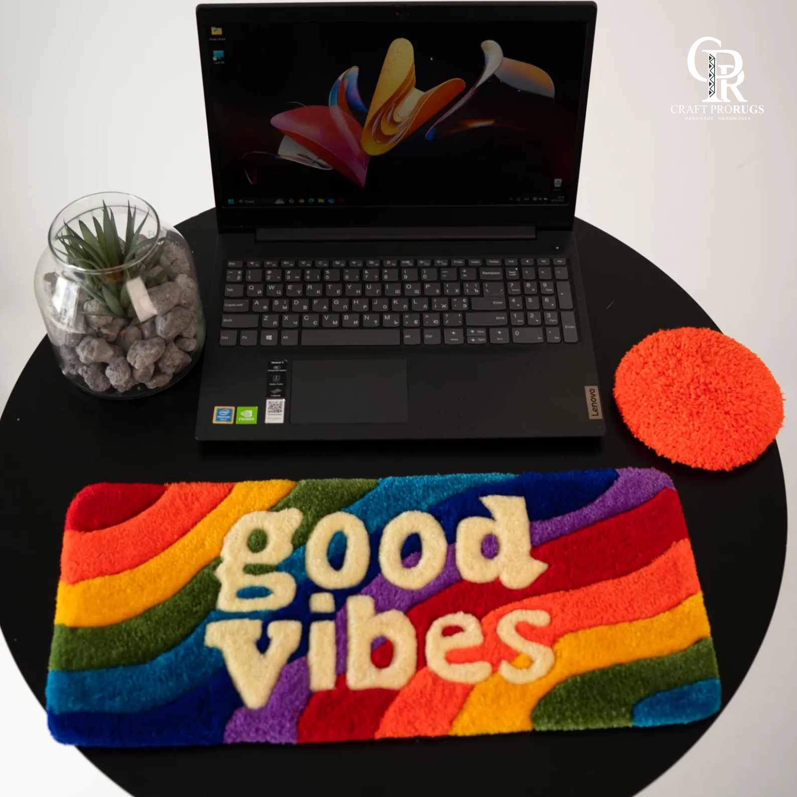 Top setup view of Vibe Stripe Keyboard Rug on desk showing ergonomic wrist pad placement and bright rainbow pattern”