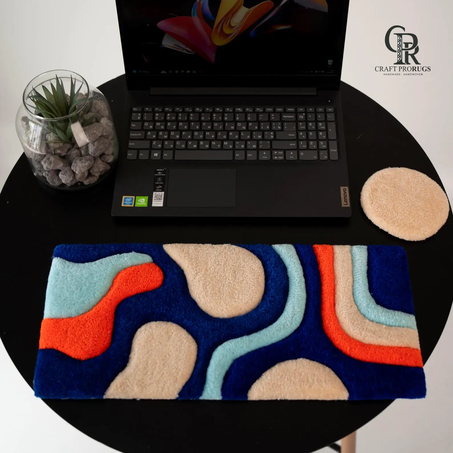 Top view of Wave Flow Desk Rug showing handmade abstract wave design with soft colorful texture