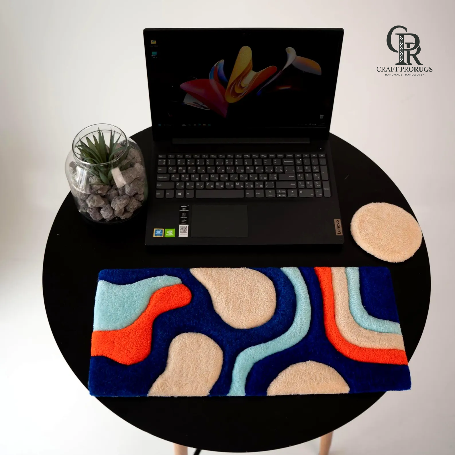 Top view of Wave Flow Desk Rug showing handmade abstract wave design with soft colorful texture