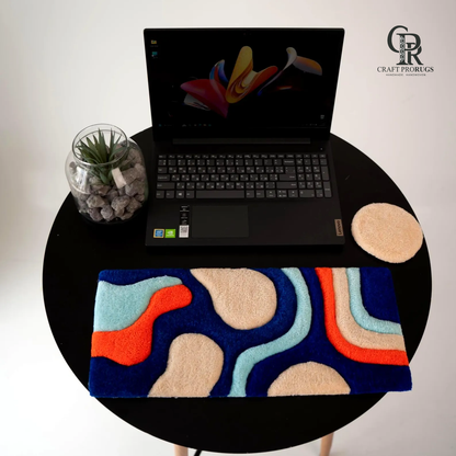 Top view of Wave Flow Desk Rug showing handmade abstract wave design with soft colorful texture
