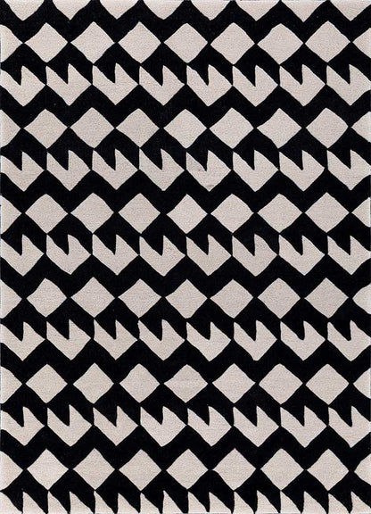 Full view of black and white zigzag monochrome wool rug, modern geometric design, hand-tufted.