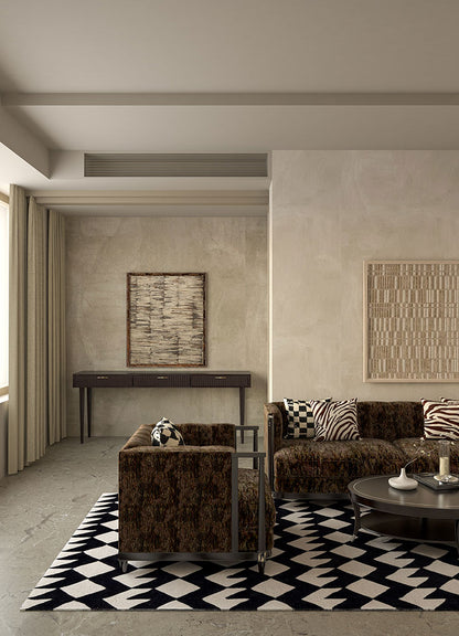 Zigzag monochrome wool rug in a modern living room with sofa and coffee table, hand-tufted design.